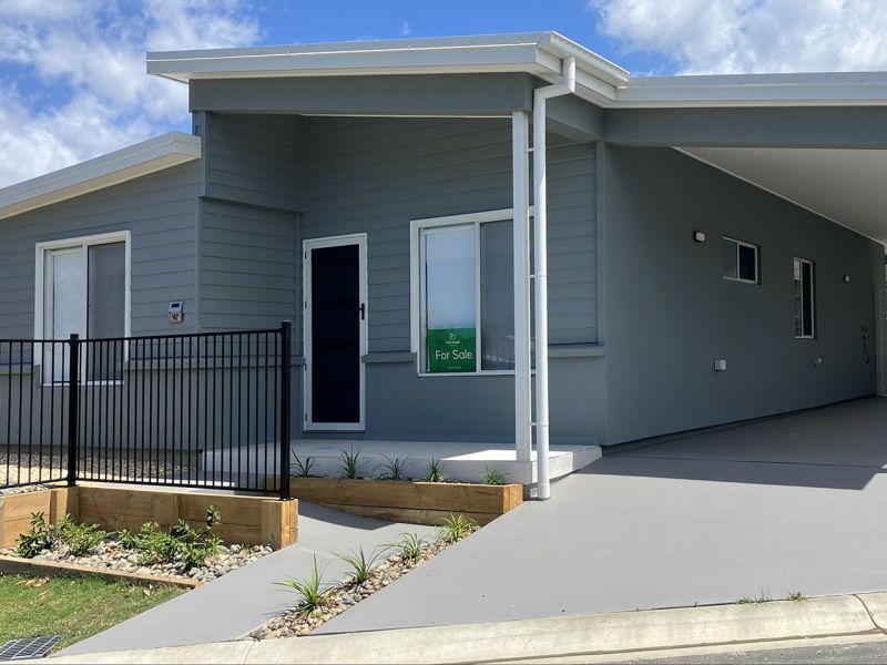 Opposite green space, on a corner lot