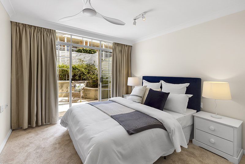 Ideally located, stylish ground floor unit near the Clubhouse with rear courtyard