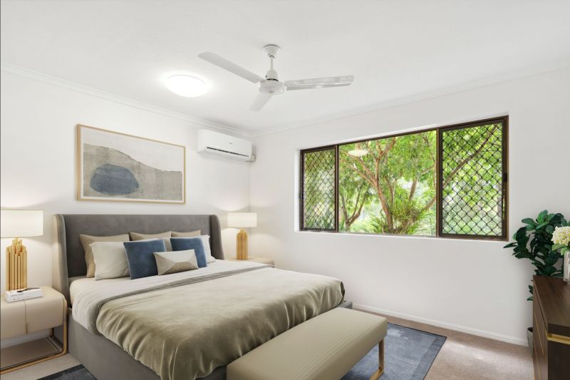 Charming two-bedroom apartment surrounded by lush greenery