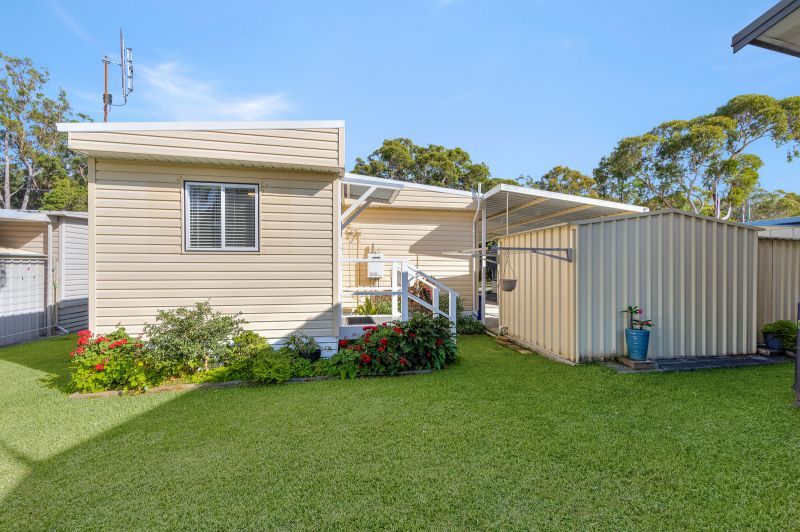 Coastal Gem! Stylish Updates & Serene Green Space