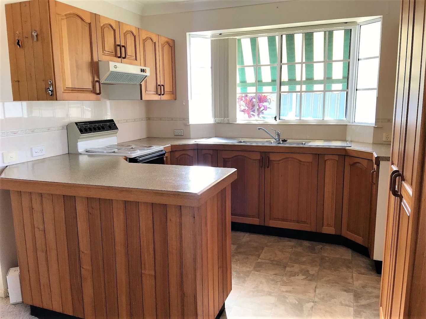 Two bedroom home on a large site,  a  short stroll away from recreation area, lush bushland and shopping centre