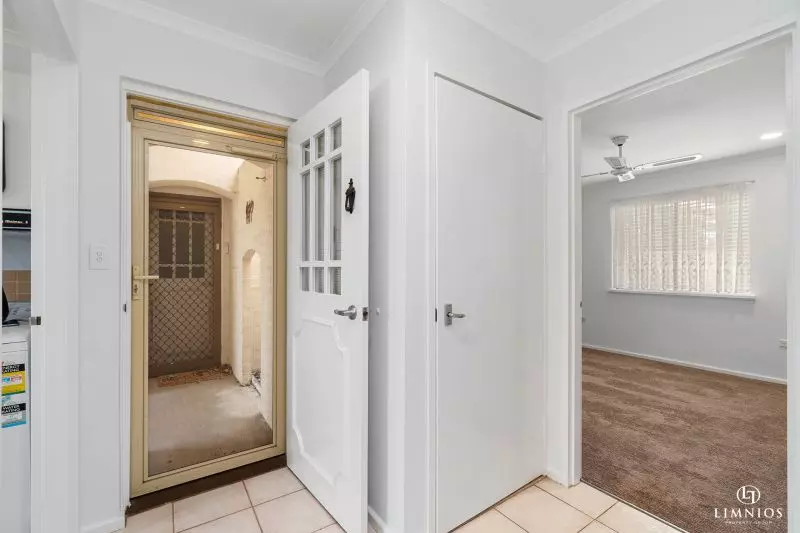 SOLD! A bright, light filled unit with a sunroom and leafy outlook
