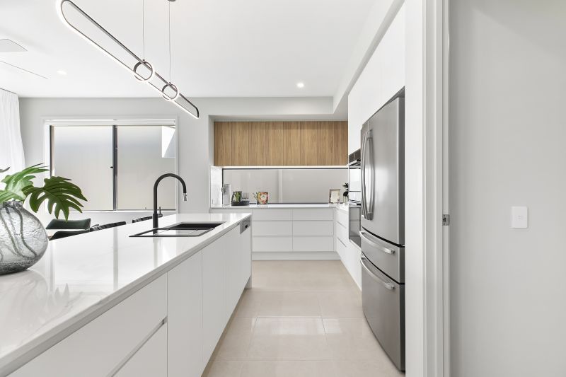 STUNNING DISPLAY HOME FACING TRANQUIL LAKE