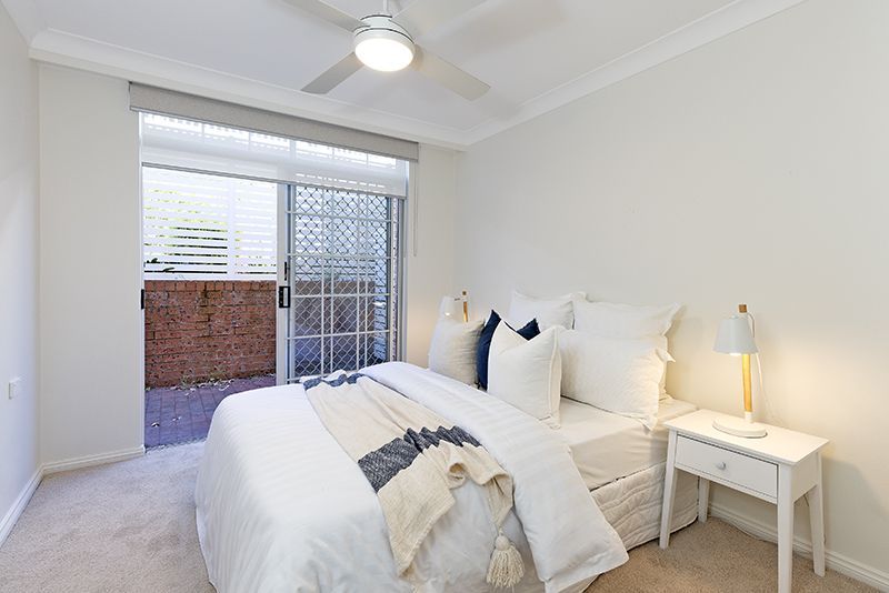 Surrounded by lovely gardens, beautifully renovated ground floor sun-filled unit, right opposite the croquet lawn.