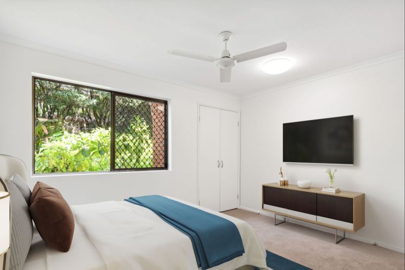 Charming two-bedroom apartment surrounded by lush greenery