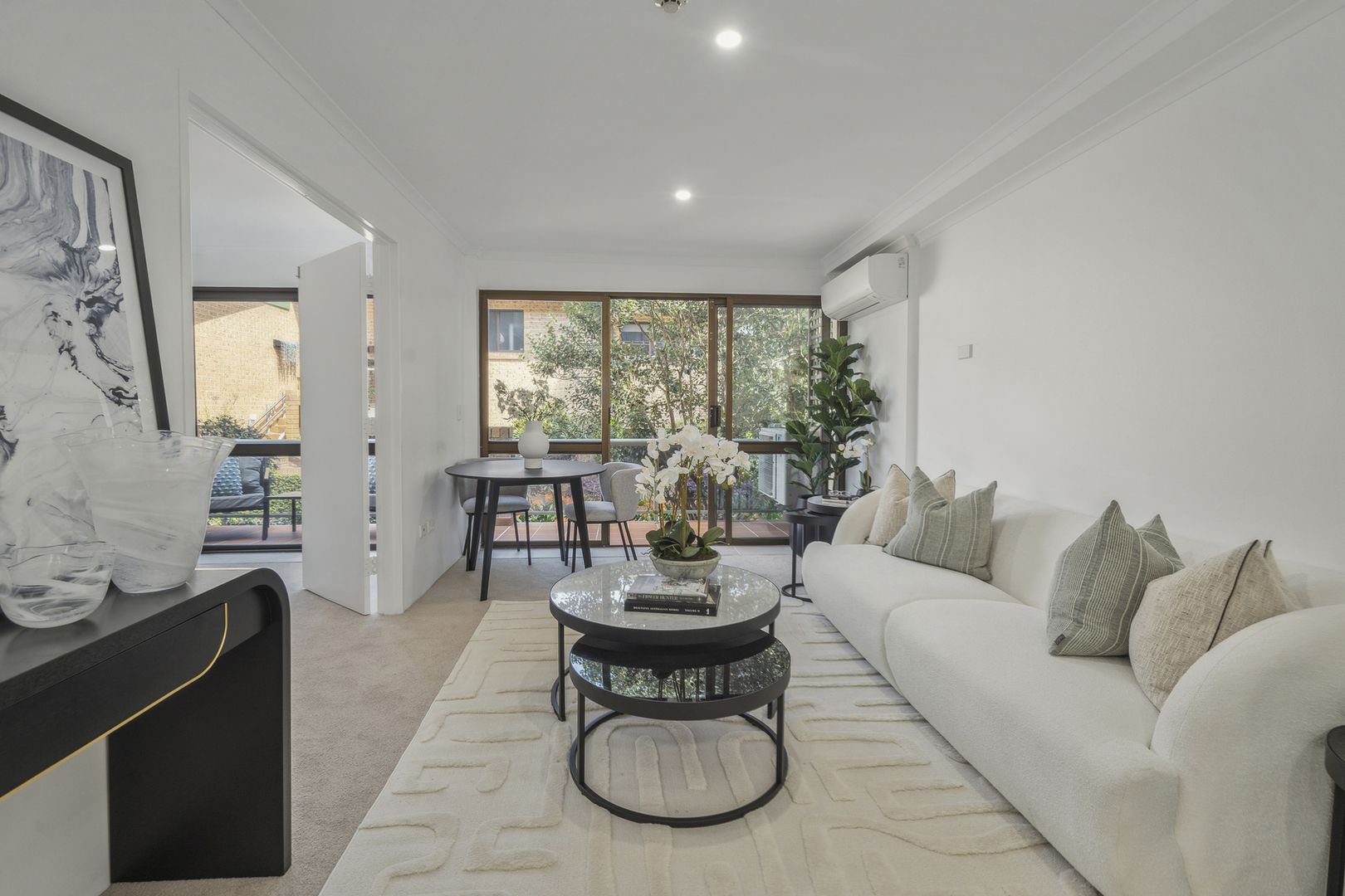 A serviced apartment surrounded by garden greenery