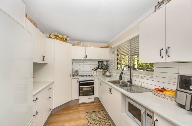 Coastal Gem! Stylish Updates & Serene Green Space