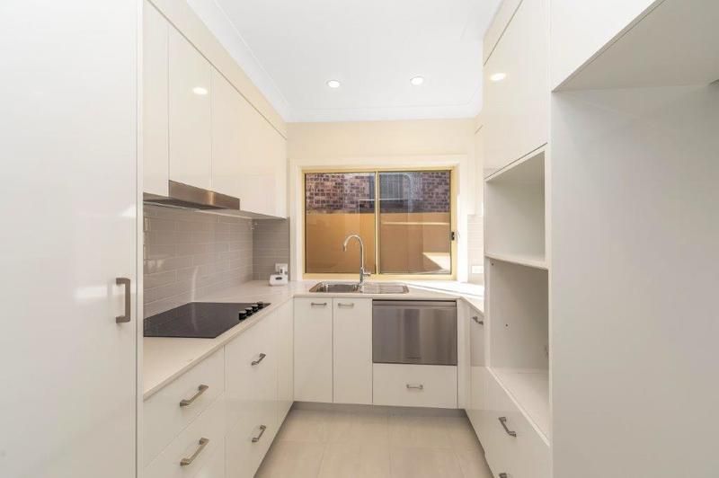 Modern Unit with Sunlit Courtyard, Water Views, and Stylish Upgrades