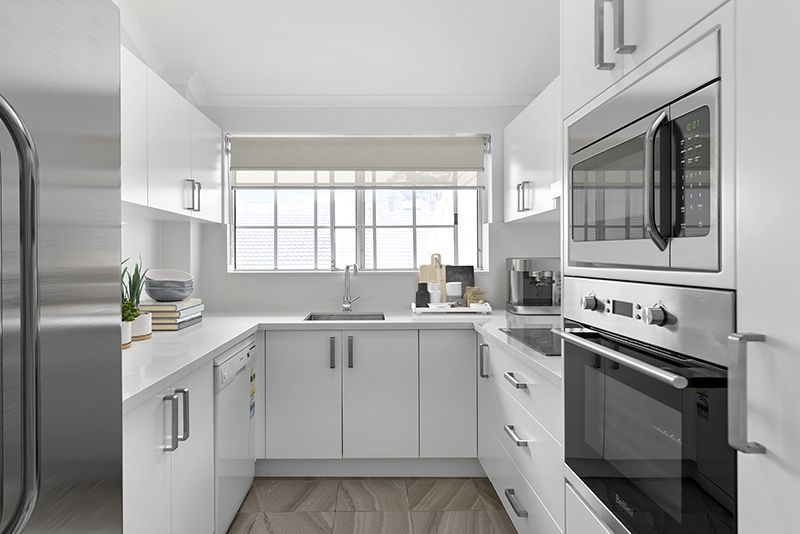 Exquisitely maintained and conveniently located sun-filled unit