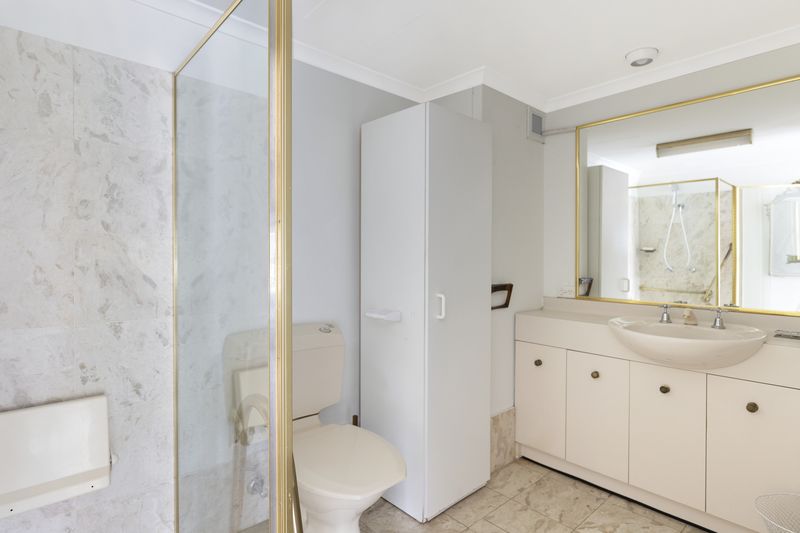 Sunny ground floor serviced apartment with garden and pool views.