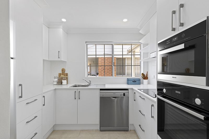 Beautifully renovated 2 bedroom unit with sunny balcony and light-filled throughout.