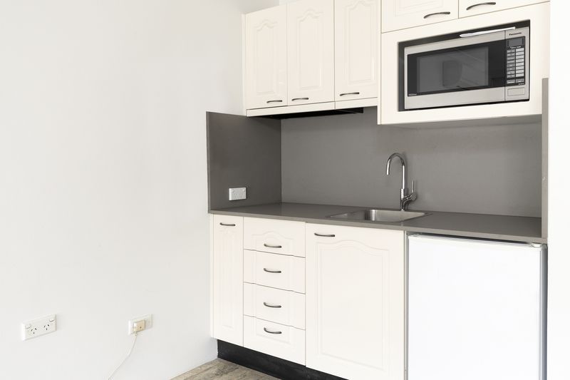 Sunny ground floor serviced apartment with garden and pool views.