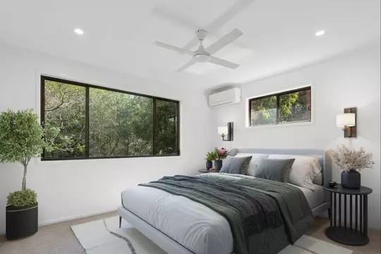 Charming two-bedroom apartment surrounded by lush greenery