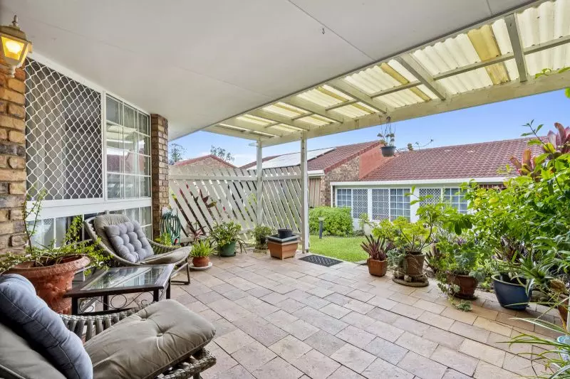 Beautiful two-bedroom, one bathroom villa with covered rear entertaining area.