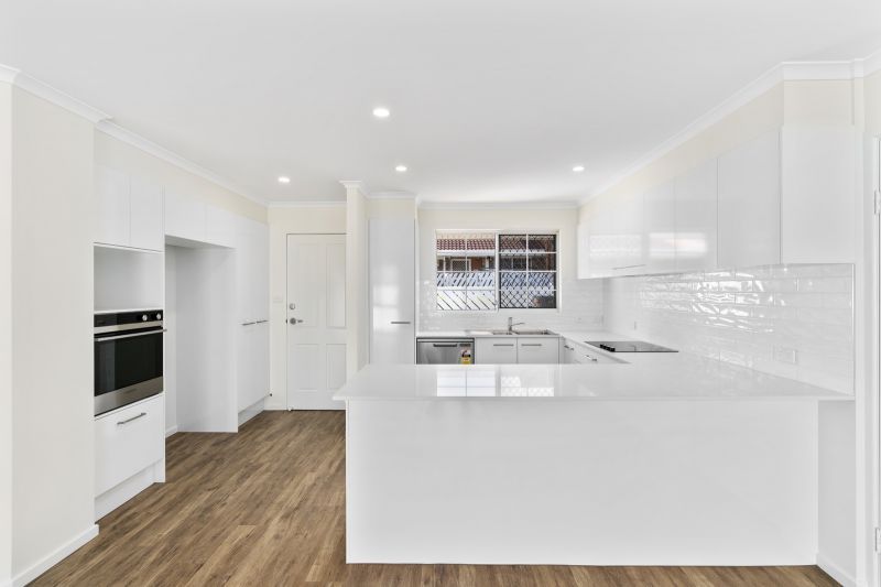Beautiful two-bedroom, one bathroom villa with enclosed rear entertaining area.