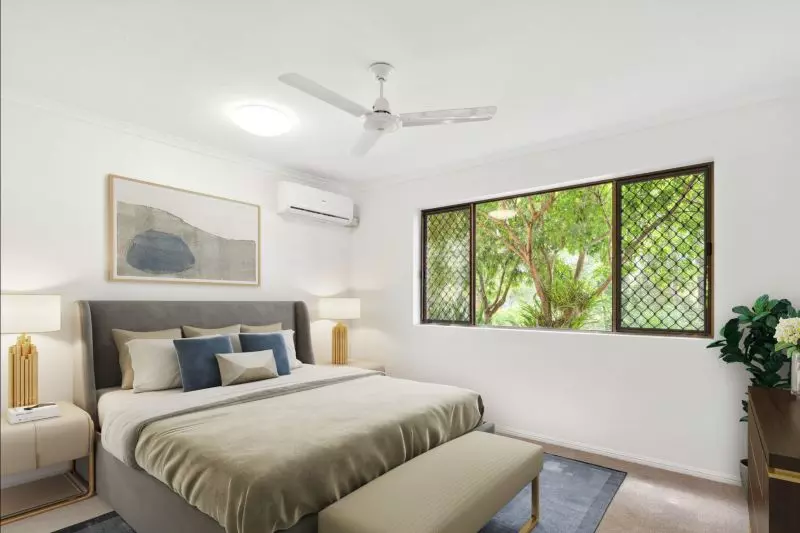 Charming two-bedroom apartment surrounded by lush greenery