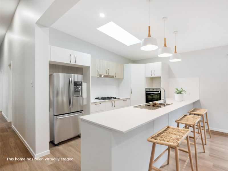 Opposite green space, on a corner lot