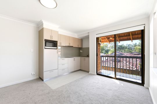 Bright corner apartment close to village amenities