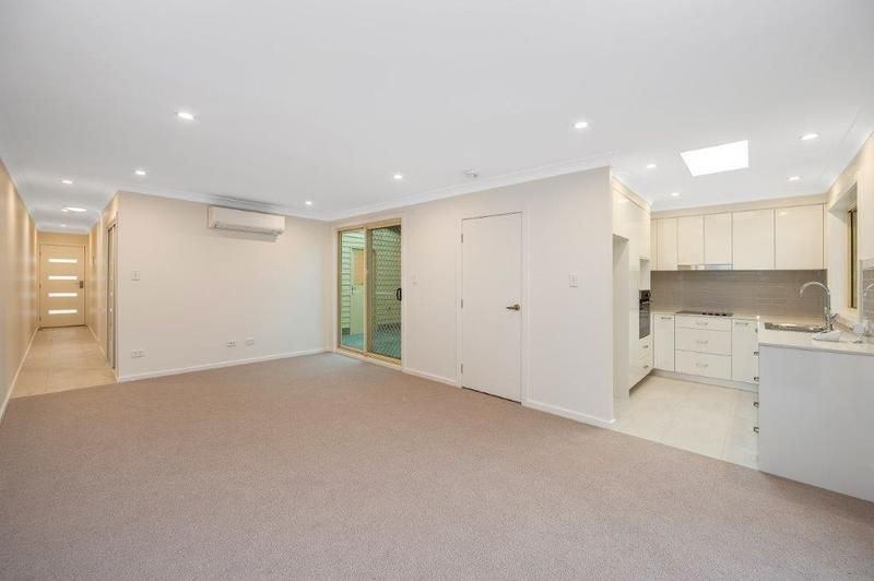 Modern Living with Sunroom and Entertainer’s Balcony