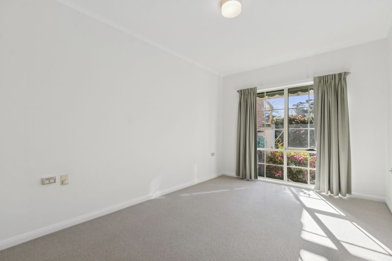 Village Heart Retreat with Vaulted Ceilings and Courtyard