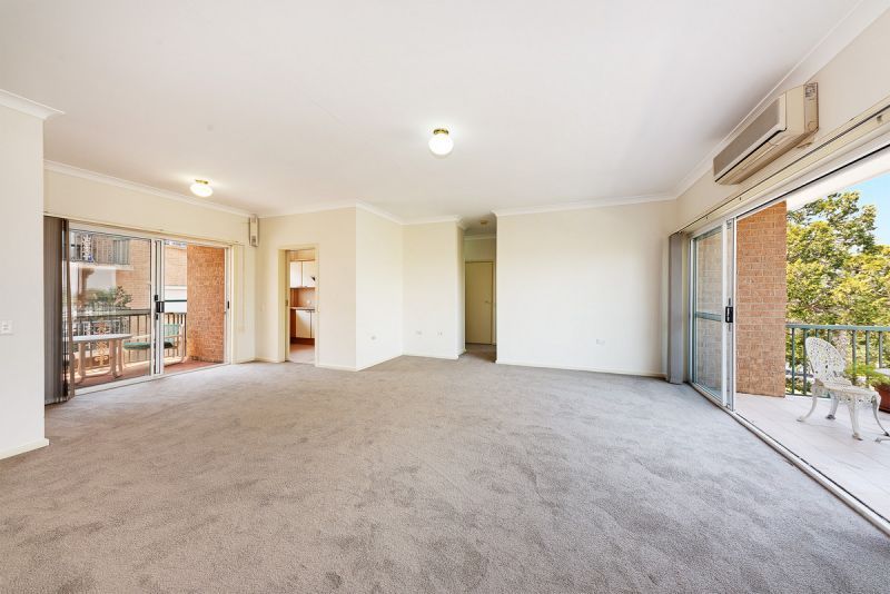 SPACIOUS  Freshly carpeted 2 bedder with both North and South facing balconies