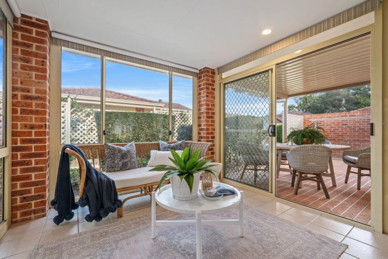 East facing rear aspect with enclosed sunroom & patio area for entertaining