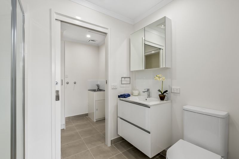 Stylish, Sunlit Unit with Private Backyard and Modern Upgrades