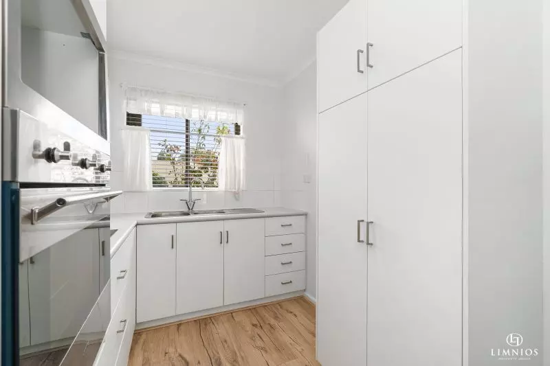 SOLD! A bright, light filled unit with a sunroom and leafy outlook