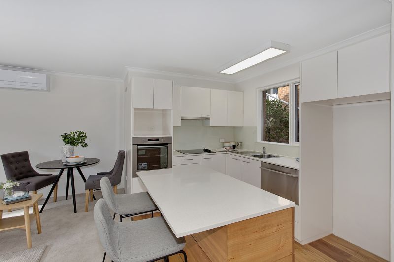 Serene two-bedroom haven overlooking lush forest