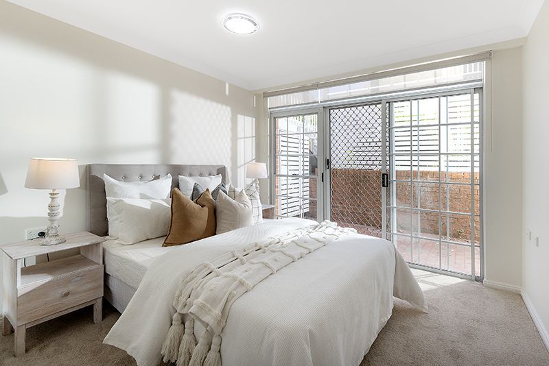 Surrounded by lovely gardens, beautifully renovated ground floor sun-filled unit, right opposite the croquet lawn.