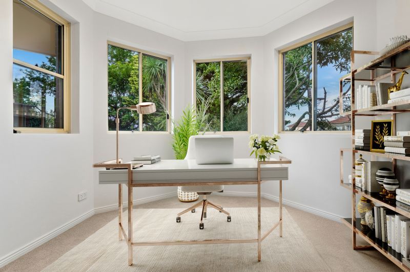 Turn-Key Corner Apartment Bathed in Natural Light