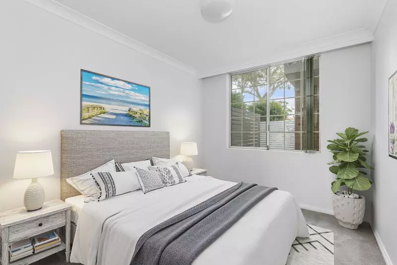 Centrally located, renovated ground floor unit surrounded by lush gardens with large courtyard.