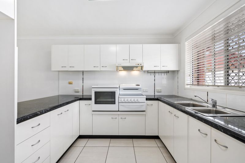 Beautiful two-bedroom, one bathroom villa with covered rear entertaining area.