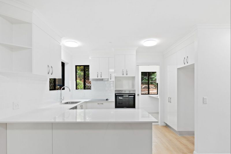 Charming three-bedroom lower ground apartment surrounded by lush greenery