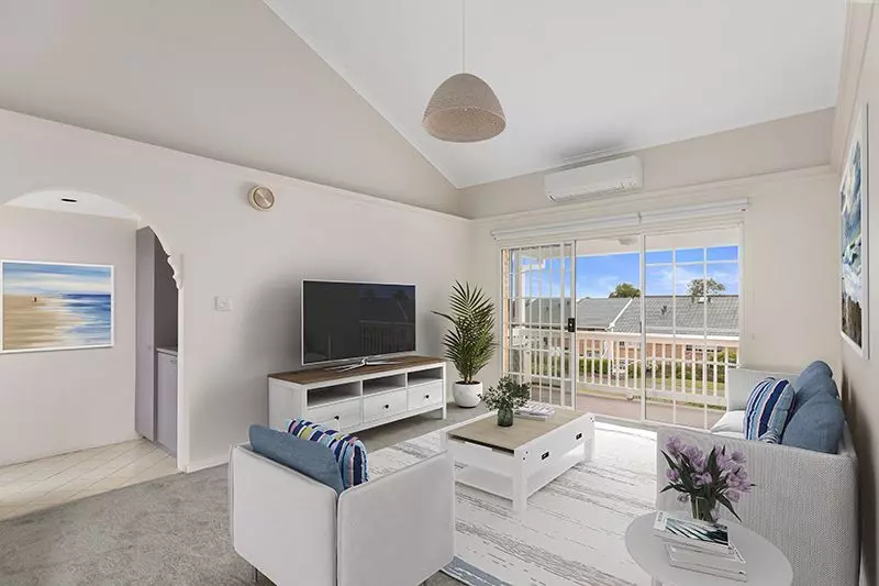 Perfectly located unit overlooking lush, green gardens.