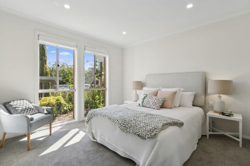 Exclusive three-bedroom villa featuring a pristine backyard