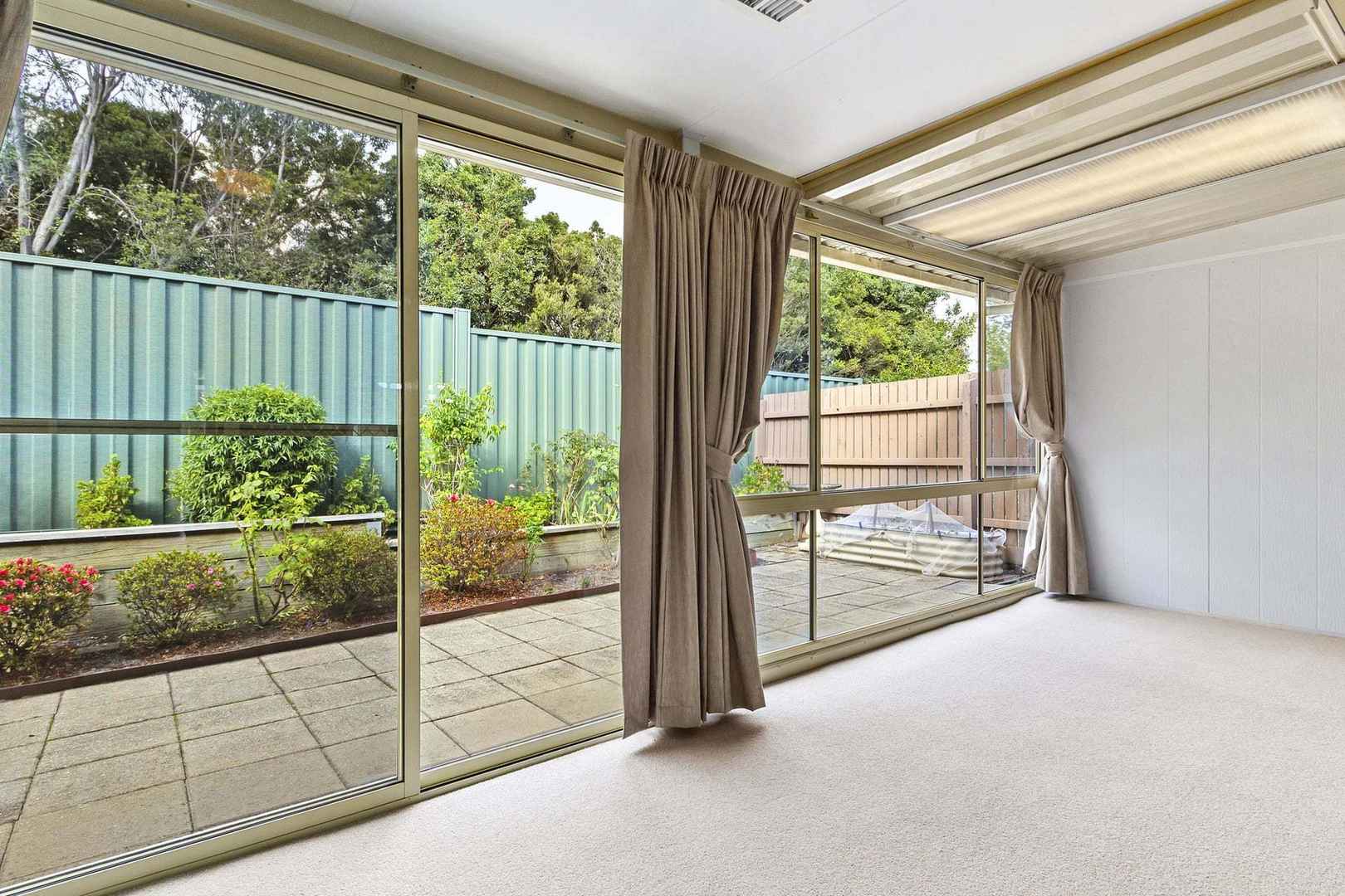 Light-Filled Living with Sunroom and Private Courtyard