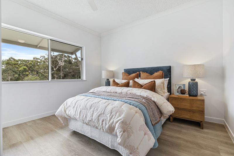 Light-filled modern apartment with lovely views of the gardens and pool!