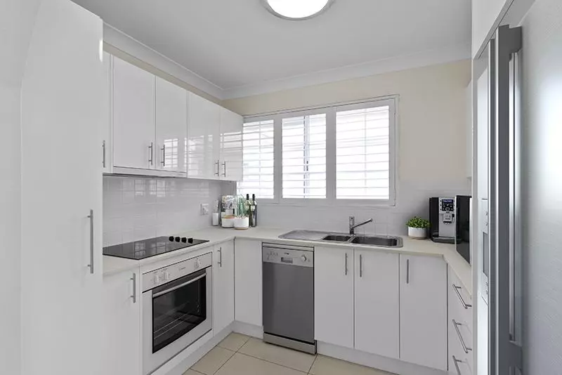 Exquisitely renovated light-filled unit overlooking croquet lawn.