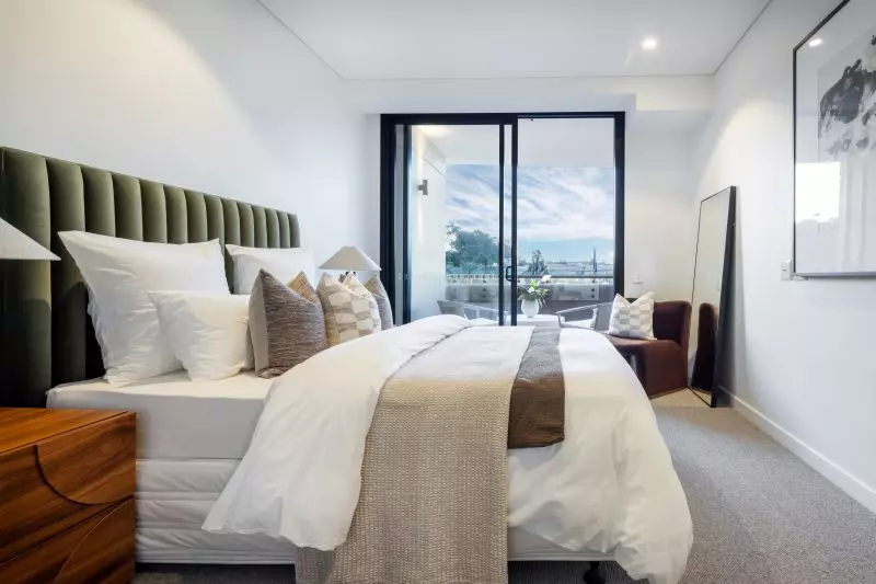 Generous, light-filled two-bedroom residence with a private balcony