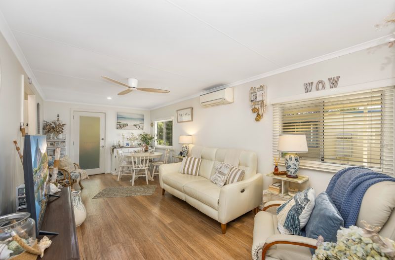 Coastal Gem! Stylish Updates & Serene Green Space