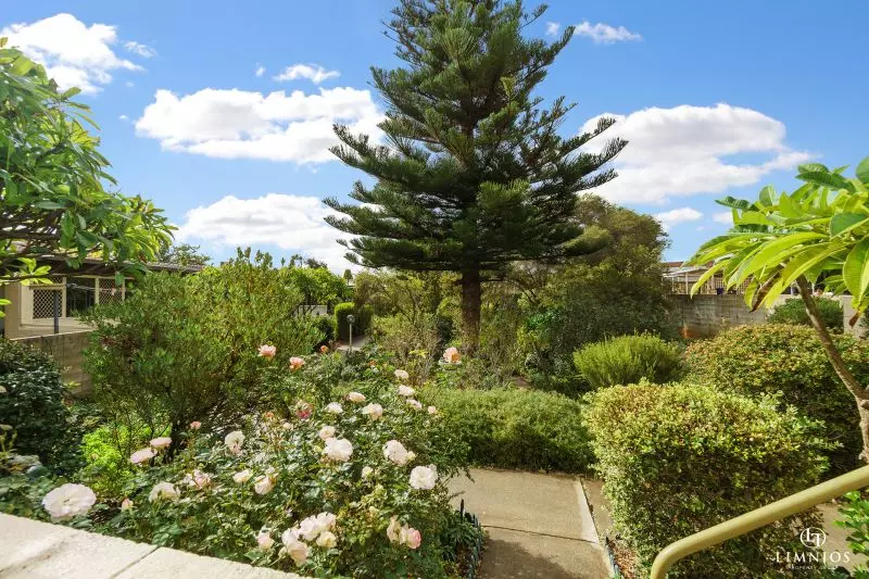 SOLD! A bright, light filled unit with a sunroom and leafy outlook