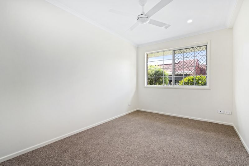 Beautiful two-bedroom, one bathroom villa with covered rear entertaining area.