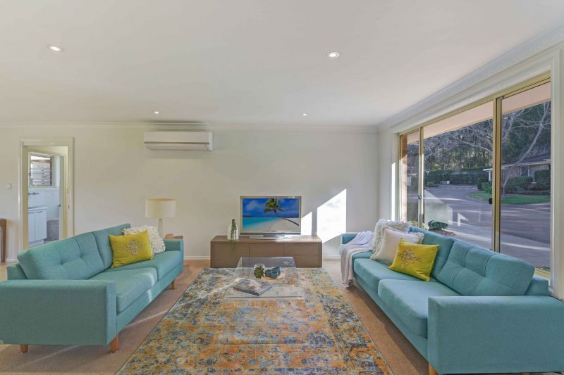 Sit back and relax on your patio! Looking onto the parkland enjoying the lifestyle here at Tarragal Glen!