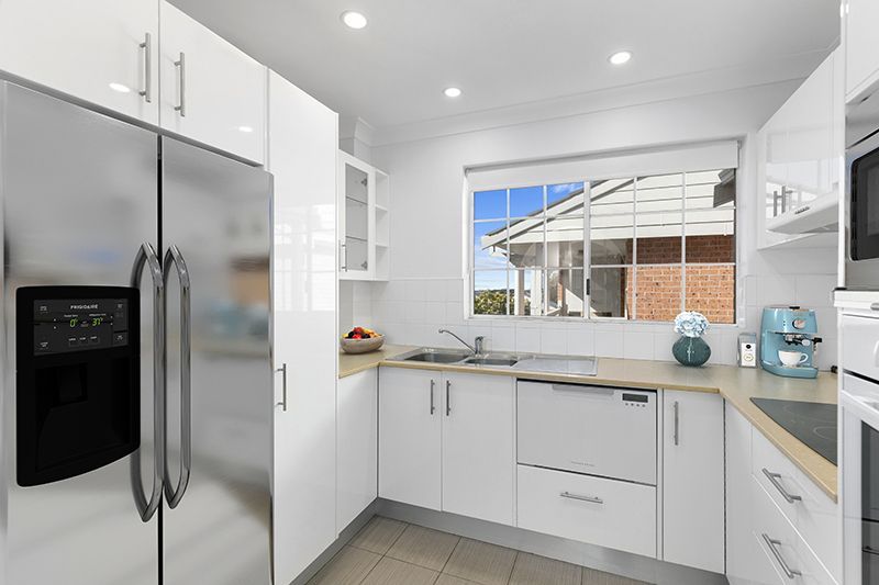 Beautifully appointed 2 bedroom unit with stunning garden and district views + bonus 24 months free fees!