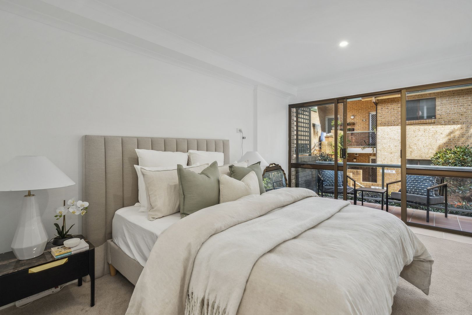 A serviced apartment surrounded by garden greenery