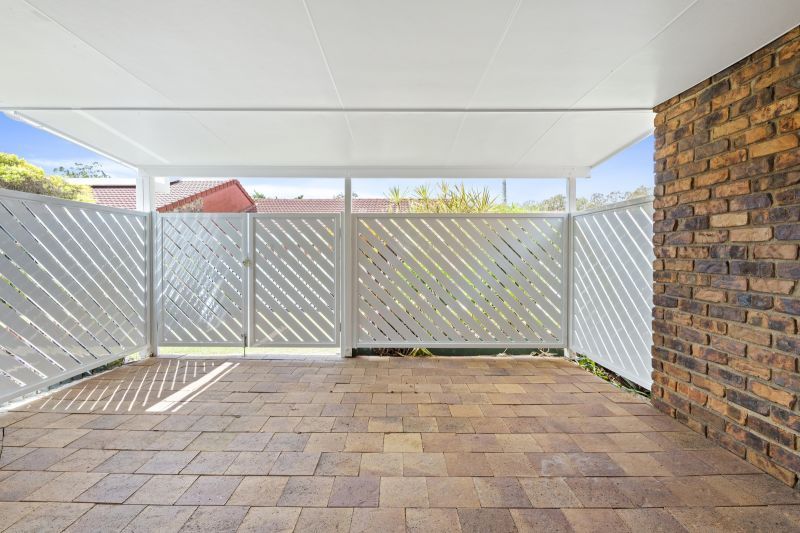 Beautiful two-bedroom, one bathroom villa with covered rear entertaining area.