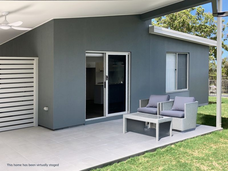 Opposite green space, on a corner lot