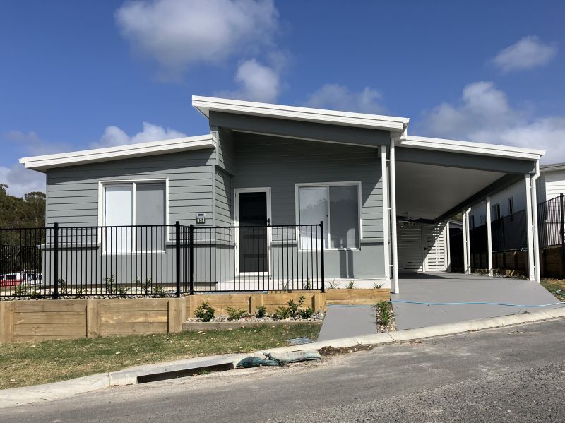 Opposite green space, on a corner lot