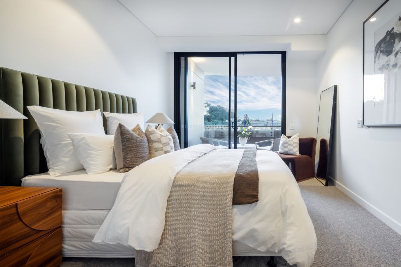 Generous, light-filled two-bedroom residence with a private balcony